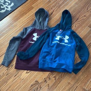 Red and blue Under Armour hoodies